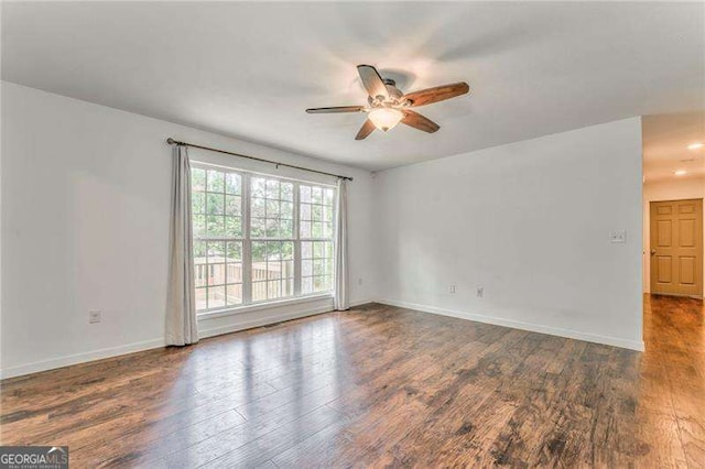 460 Broad St, Tallapoosa, GA 30176 - unfurnished room featuring a ceiling fan and wood finished floors