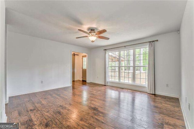 460 Broad St, Tallapoosa, GA 30176 - spare room featuring a ceiling fan and wood finished floors