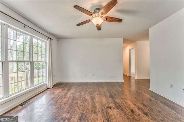 460 Broad St, Tallapoosa, GA 30176 - empty room with plenty of natural light, a ceiling fan, and wood finished floors