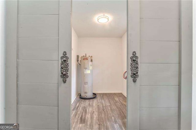 460 Broad St, Tallapoosa, GA 30176 - hall featuring electric water heater and wood finished floors