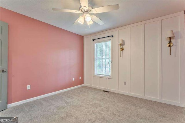 460 Broad St, Tallapoosa, GA 30176 - unfurnished bedroom with light carpet and a ceiling fan