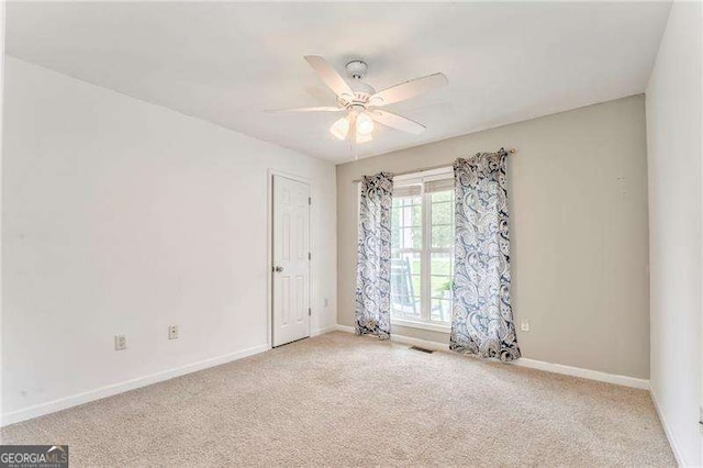 460 Broad St, Tallapoosa, GA 30176 - empty room featuring carpet flooring and ceiling fan