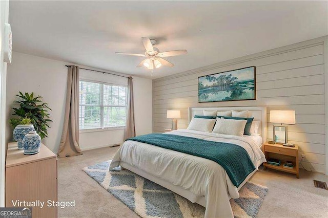 460 Broad St, Tallapoosa, GA 30176 - bedroom with light colored carpet, wooden walls, and ceiling fan