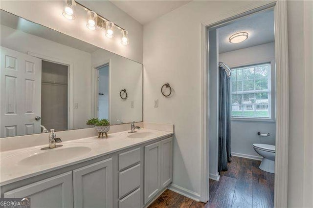 460 Broad St, Tallapoosa, GA 30176 - bathroom featuring double vanity and wood finished floors