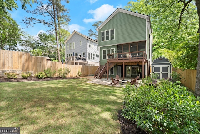 rear view of house with a storage unit, stairs, a sunroom, a patio, and a fire pit