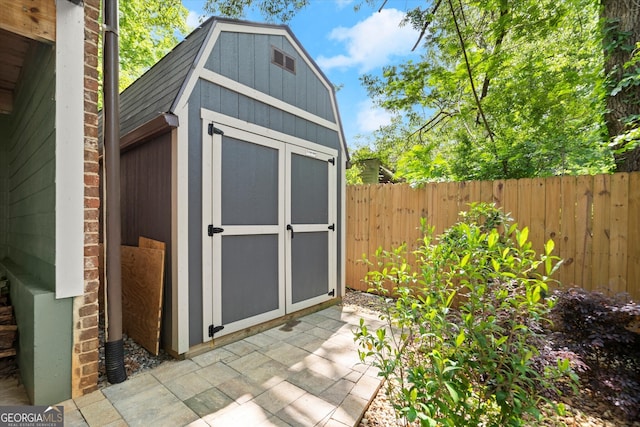 view of shed with a fenced backyard