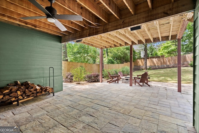 3668 Spring St, Chamblee, GA 30341 - fenced backyard featuring a fire pit, a patio, and ceiling fan