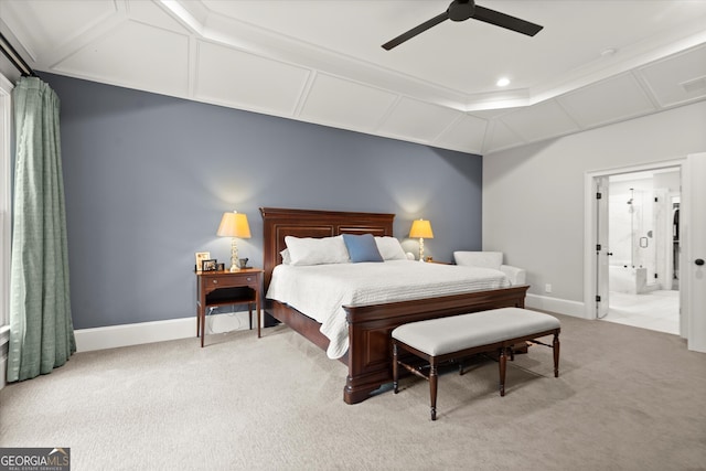 bedroom with baseboards, ceiling fan, ensuite bathroom, and light colored carpet