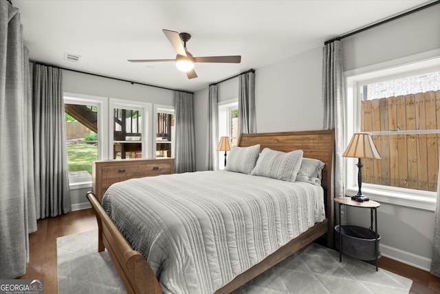 3668 Spring St, Chamblee, GA 30341 - bedroom with multiple windows, wood finished floors, and ceiling fan