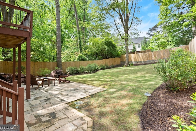3668 Spring St, Chamblee, GA 30341 - fenced backyard featuring an outdoor fire pit, a patio area, and a deck