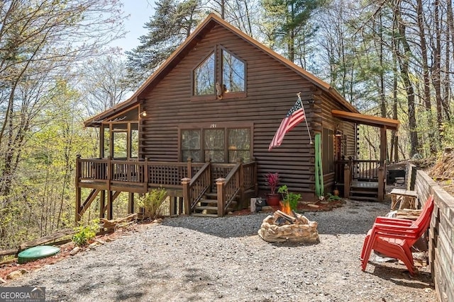 191 Mountain View Rd, Ellijay, GA 30540 - back of property featuring a fire pit, log exterior, and a deck