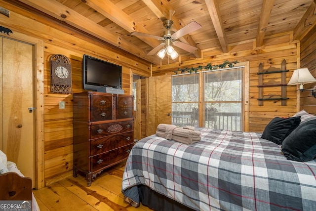 191 Mountain View Rd, Ellijay, GA 30540 - bedroom with wood walls, light wood-style flooring, and wooden ceiling with exposed beams