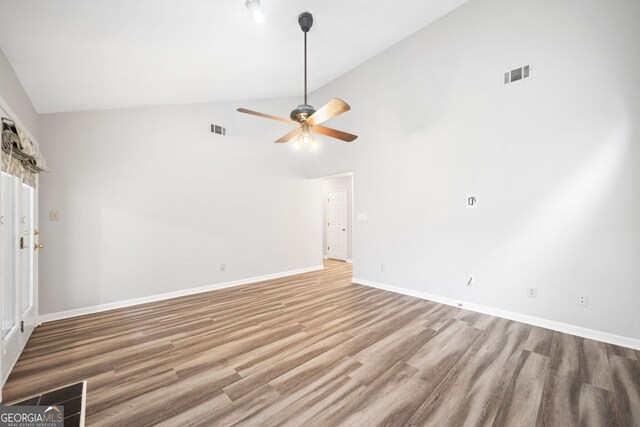 3765 Windsor Cir, Clarkston, GA 30021 - unfurnished living room with a ceiling fan, visible vents, wood finished floors, and baseboards