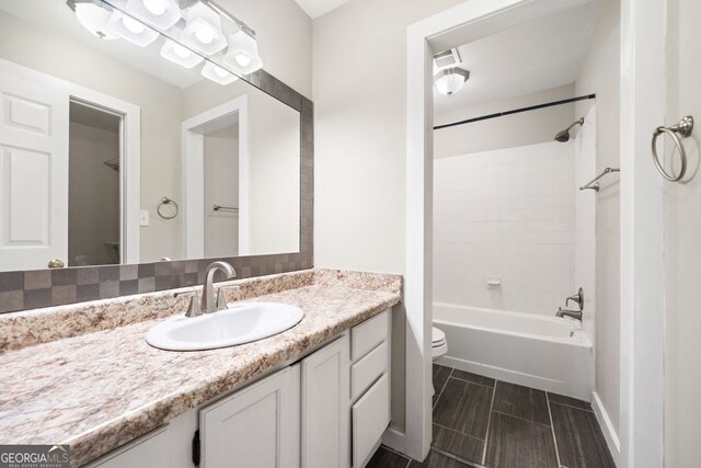 3765 Windsor Cir, Clarkston, GA 30021 - bathroom with baseboards, bathing tub / shower combination, toilet, and vanity