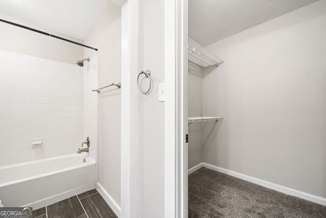 3765 Windsor Cir, Clarkston, GA 30021 - bathroom with a spacious closet, shower / bath combination, and baseboards