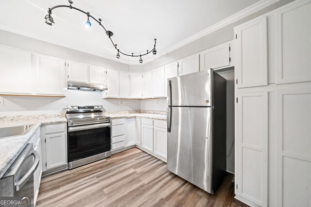 3765 Windsor Cir, Clarkston, GA 30021 - kitchen featuring crown molding, white cabinets, light wood-style floors, stainless steel appliances, and under cabinet range hood