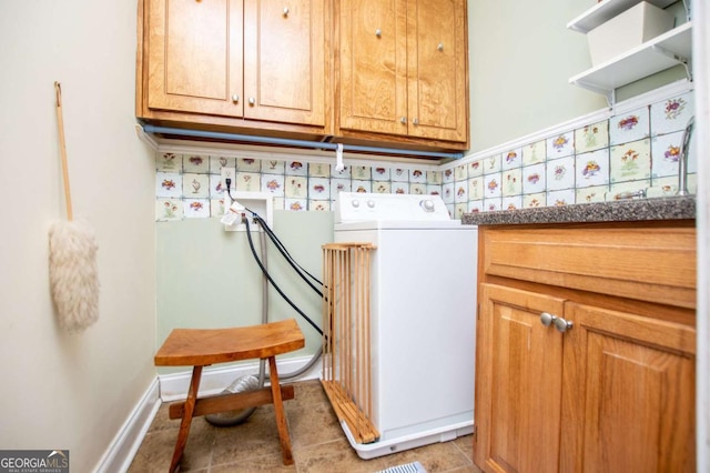 laundry area with hookup for a washing machine, cabinet space, and light tile patterned floors