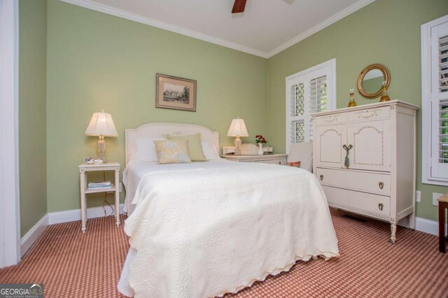 bedroom featuring crown molding, carpet flooring, baseboards, and a ceiling fan