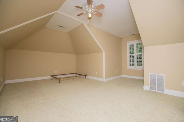 bonus room featuring visible vents, carpet, and vaulted ceiling