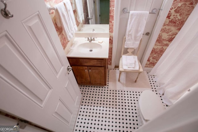 full bathroom with vanity and a shower stall