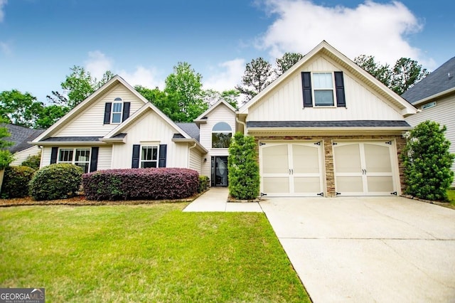 view of front of home with a front lawn, board and batten siding, an attached garage, and concrete driveway