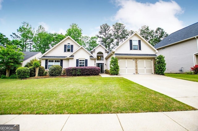 view of front of house with board and batten siding, driveway, an attached garage, and a front yard
