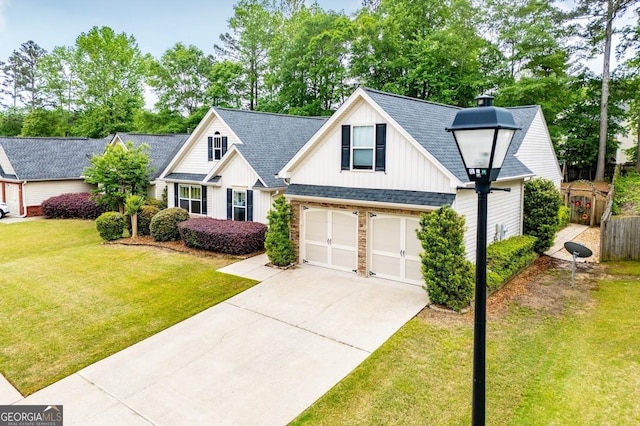 view of front facade featuring driveway, board and batten siding, a shingled roof, a front lawn, and a garage