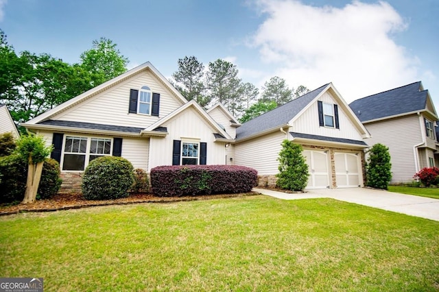 view of front of home featuring board and batten siding, concrete driveway, and stone siding