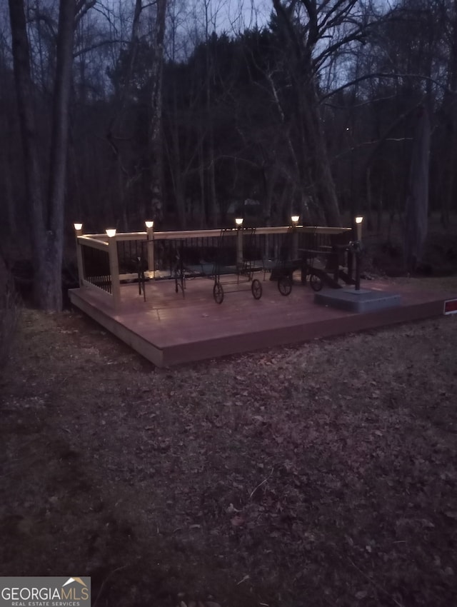 surrounding community featuring a wooden deck