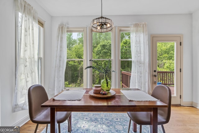 8275 Majors Ridge Way, Cumming, GA 30041 - dining room with a chandelier, baseboards, and light wood-style flooring