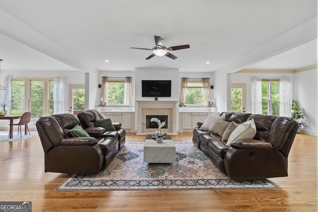 8275 Majors Ridge Way, Cumming, GA 30041 - living room with a ceiling fan, light wood-style flooring, a fireplace with flush hearth, and recessed lighting