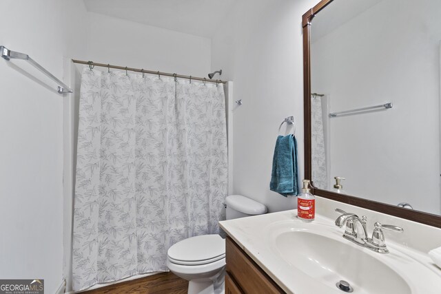 8275 Majors Ridge Way, Cumming, GA 30041 - bathroom featuring toilet, vanity, and a shower with shower curtain