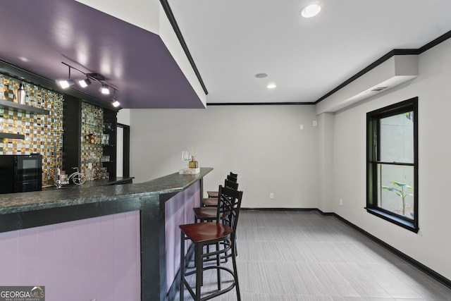 8275 Majors Ridge Way, Cumming, GA 30041 - indoor wet bar with baseboards, ornamental molding, recessed lighting, and track lighting