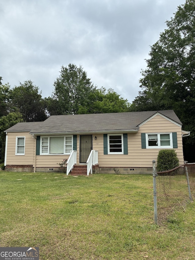 513 Lynmore Cir, Macon, GA 31206 - ranch-style home with a shingled roof, entry steps, a front lawn, and crawl space