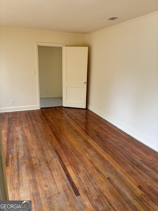 513 Lynmore Cir, Macon, GA 31206 - spare room with visible vents, hardwood / wood-style flooring, ornamental molding, and baseboards