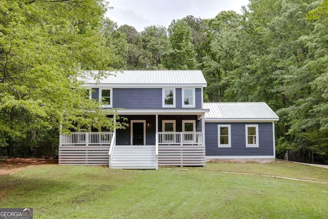 155 Hunters Pointe Dr, Athens, GA 30606 - back of property featuring metal roof, a yard, a porch, and a view of trees