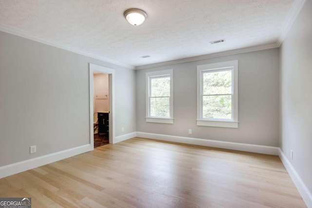 155 Hunters Pointe Dr, Athens, GA 30606 - spare room featuring a textured ceiling, light wood-style flooring, visible vents, baseboards, and ornamental molding