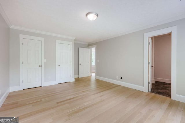 155 Hunters Pointe Dr, Athens, GA 30606 - unfurnished bedroom with light wood-style floors, crown molding, and baseboards