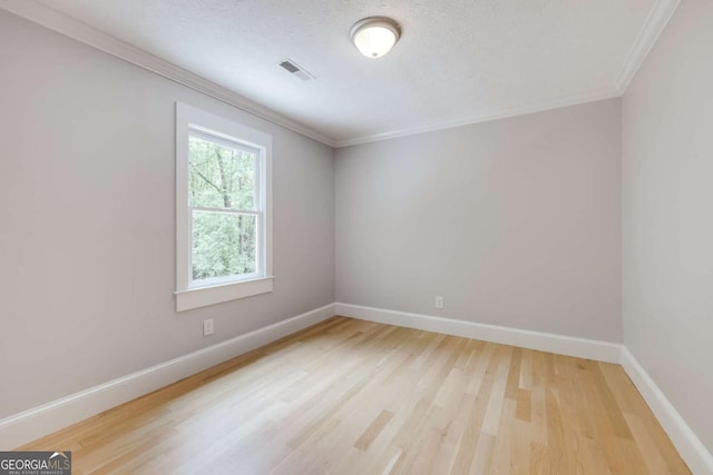 155 Hunters Pointe Dr, Athens, GA 30606 - spare room featuring ornamental molding, visible vents, light wood-style flooring, and baseboards
