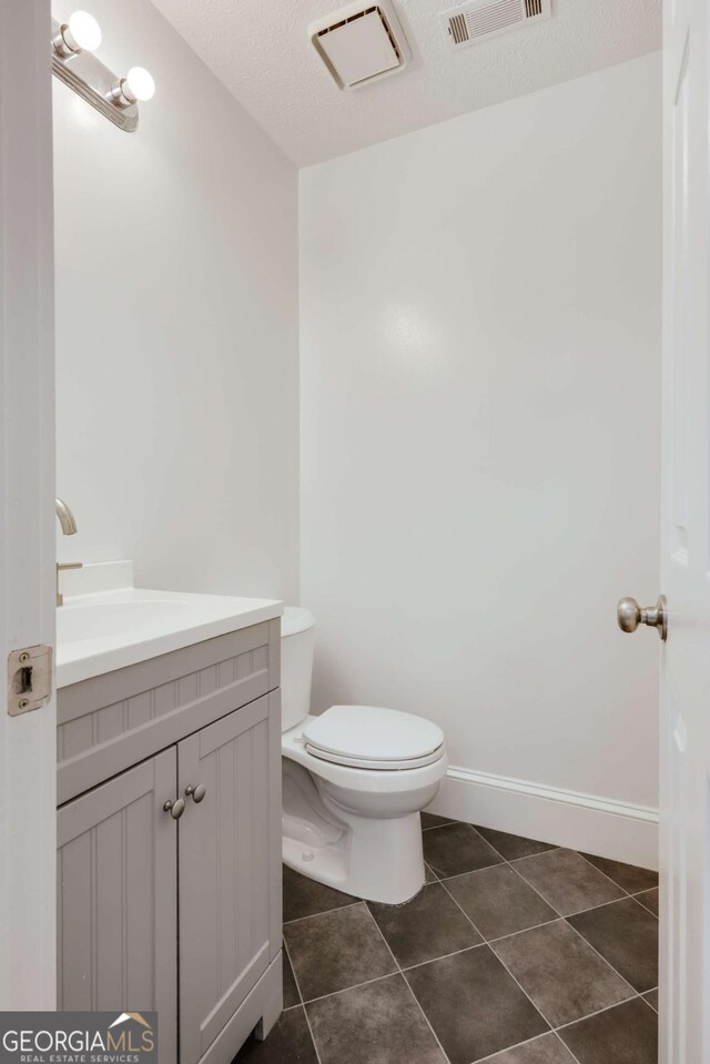 155 Hunters Pointe Dr, Athens, GA 30606 - bathroom with toilet, tile patterned floors, visible vents, and vanity