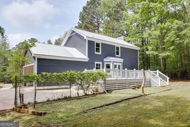 155 Hunters Pointe Dr, Athens, GA 30606 - rear view of property featuring a deck, a chimney, a yard, and metal roof
