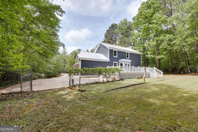 155 Hunters Pointe Dr, Athens, GA 30606 - rear view of house featuring a lawn, a chimney, and a wooden deck