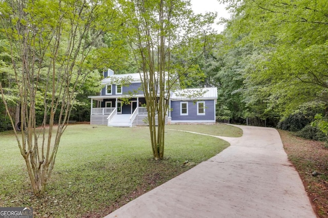 155 Hunters Pointe Dr, Athens, GA 30606 - cape cod-style house featuring a chimney, concrete driveway, a porch, and a front lawn