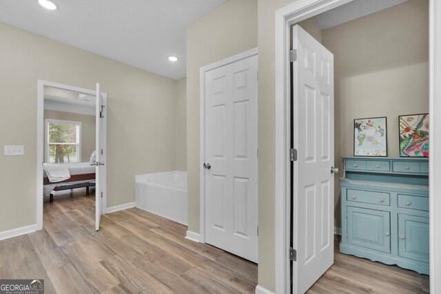 1703 Windsor Rd, Statesboro, GA 30461 - full bath with wood finished floors, a bath, and recessed lighting