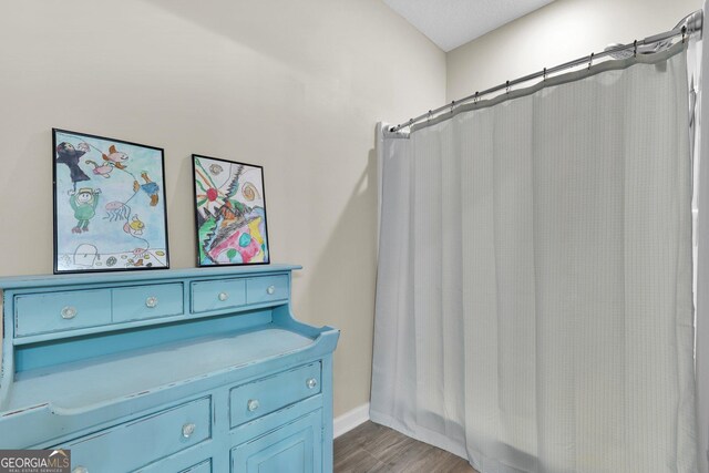 1703 Windsor Rd, Statesboro, GA 30461 - full bathroom with a shower with curtain and wood finished floors