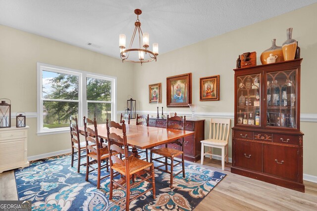1703 Windsor Rd, Statesboro, GA 30461 - dining space with a chandelier and wood finished floors