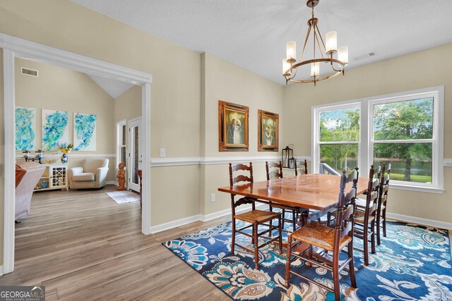 1703 Windsor Rd, Statesboro, GA 30461 - dining room with a chandelier and wood finished floors