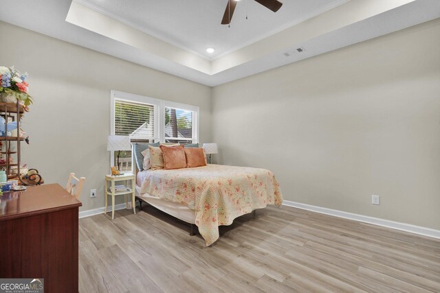 1703 Windsor Rd, Statesboro, GA 30461 - bedroom featuring crown molding, wood finished floors, a tray ceiling, ceiling fan, and recessed lighting