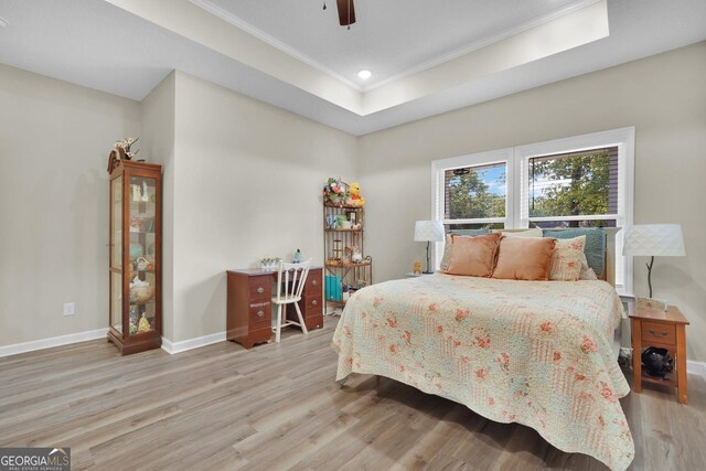 1703 Windsor Rd, Statesboro, GA 30461 - bedroom with light wood-style floors, crown molding, recessed lighting, ceiling fan, and a tray ceiling
