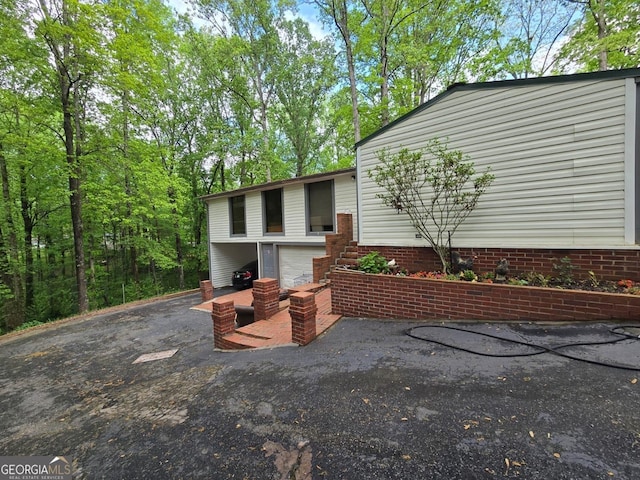 exterior space featuring an attached garage and driveway